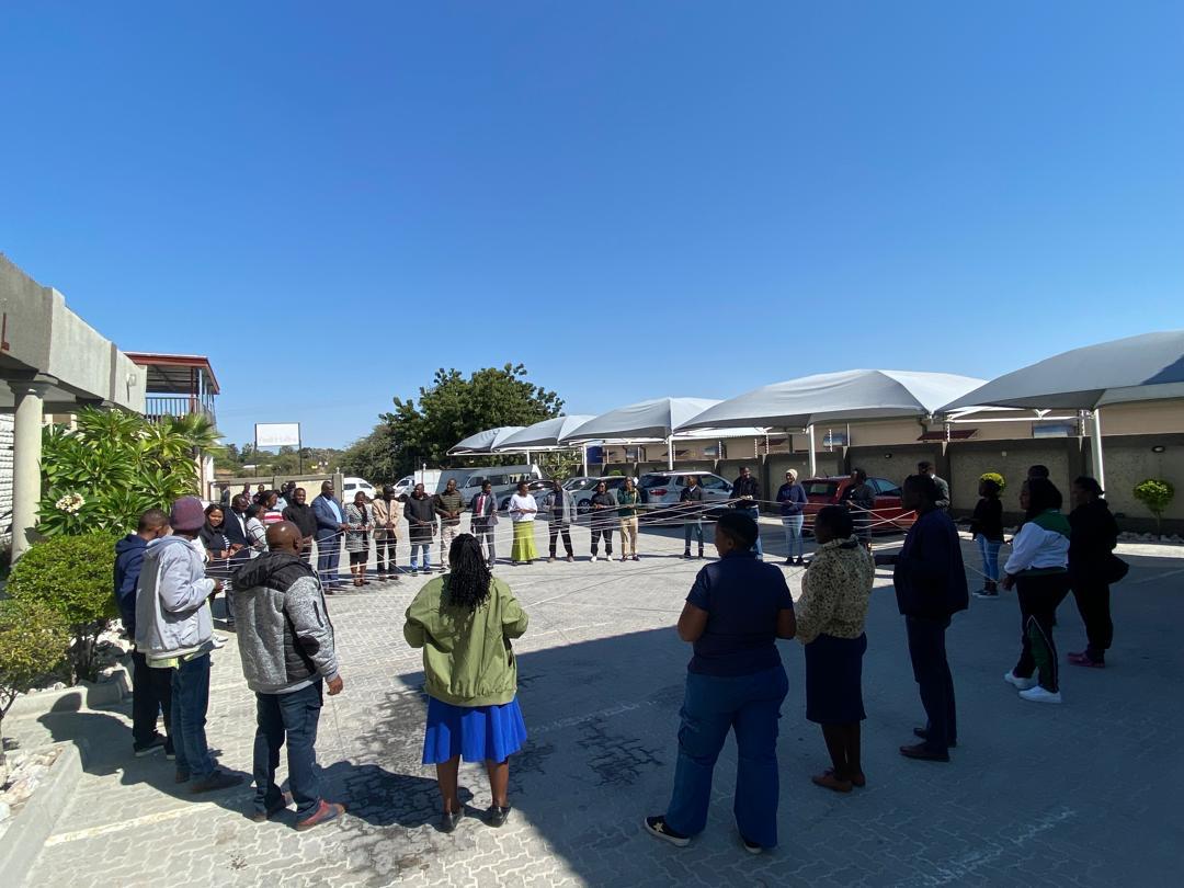 Outdoor activity with participants in a circle